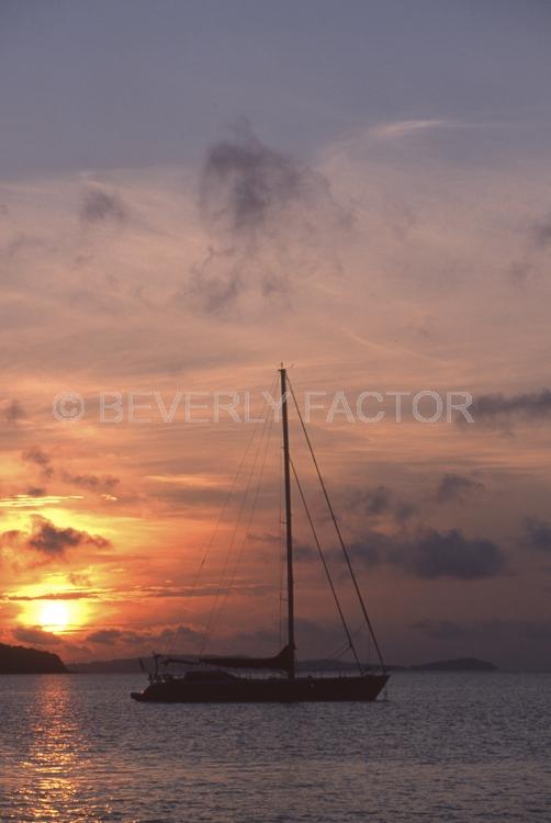 Sunset;colorful;sky;thailand;blue water;sun;yellow;water;boats;sillouettes;sailboats;anchorages;ocean